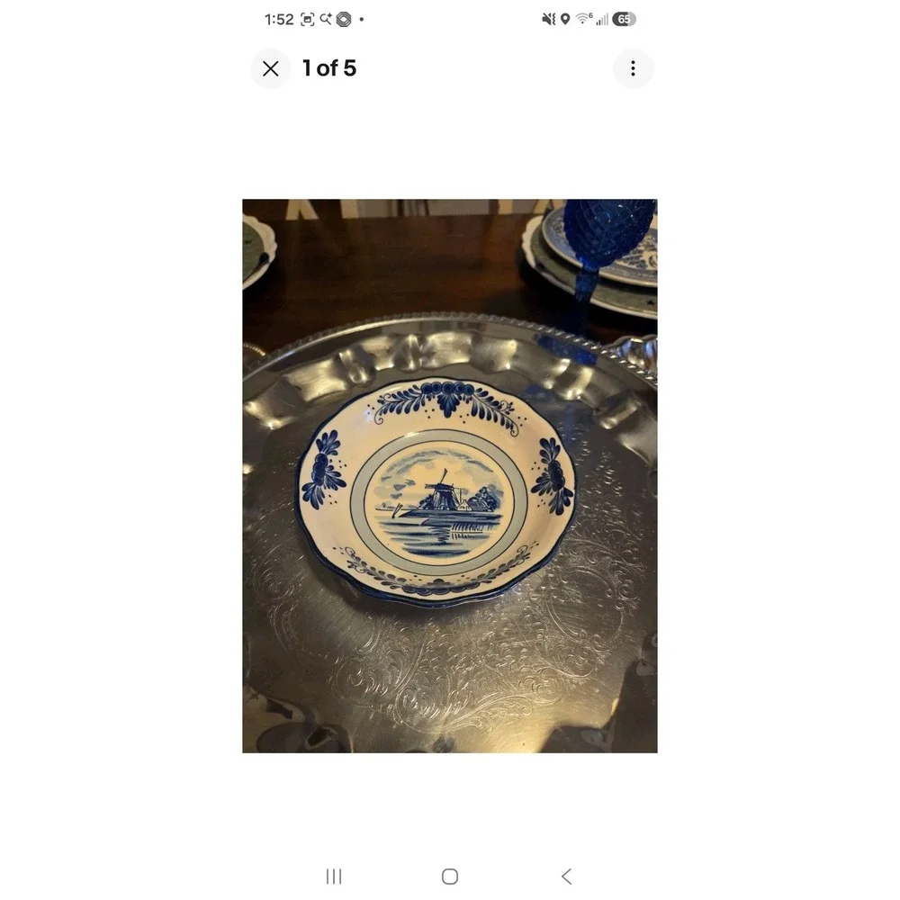 This is a vintage Delft Blue hand-painted ceramic creamer pitcher And Bowl/plate